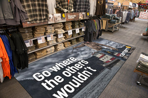Carhartt graphic printed on vinyl printable flooring displayed on retail floor in front of clothing