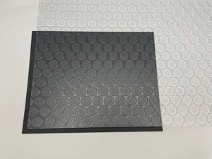 Clear Small Coin texture vinyl printable flooring in front of black vinyl segment
