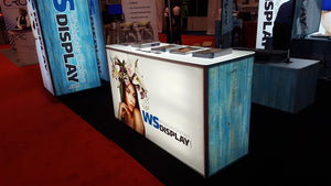 Trade show booth featuring blue and white graphics printed on G-Floor Graphic printable media